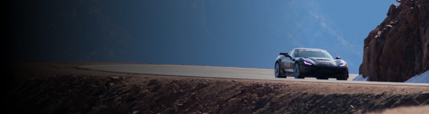 Image of sports car on curvy road through the mountains
