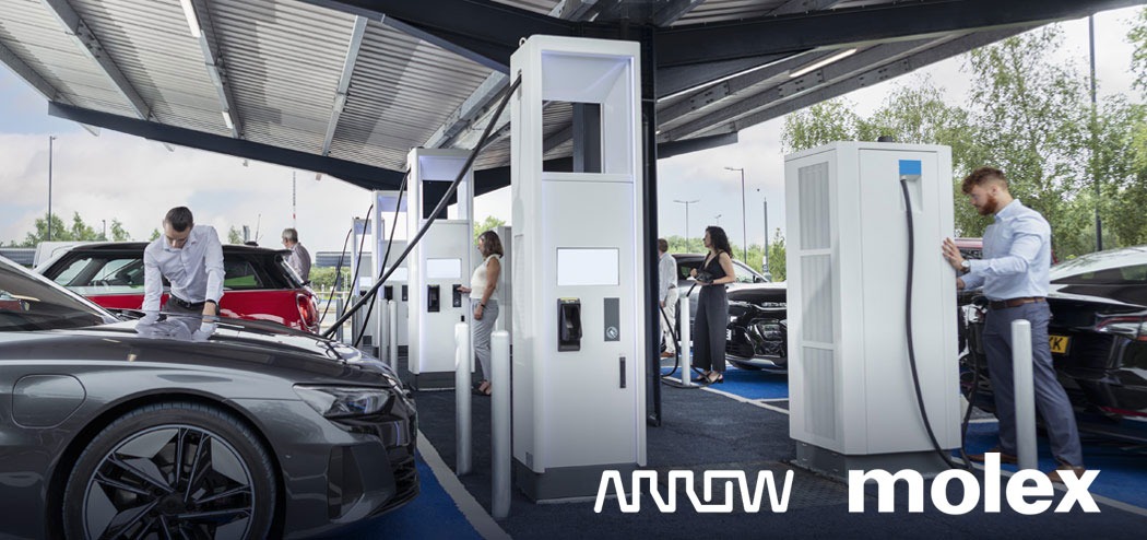 A modern electric vehicle charging station featuring multiple charging units under a covered structure